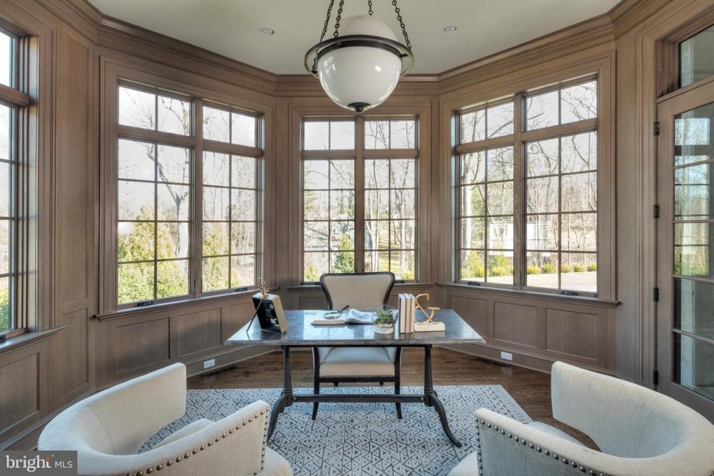 Luxury Home Office with Desk, Two White Accent Chairs Against Bay Window